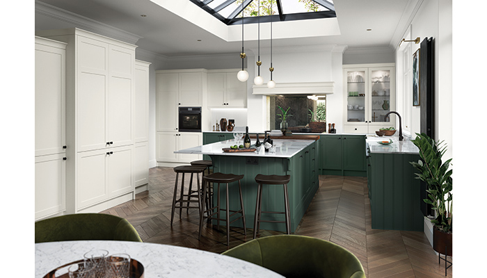 This kitchen from Caple in Novara Hunter and Porcelain Novara on modern slim Shaker doors with a smooth painted finish creates a show-stopping scheme that uses a sophisticated palette of muted and rich tones to bring a sense of calm to the space