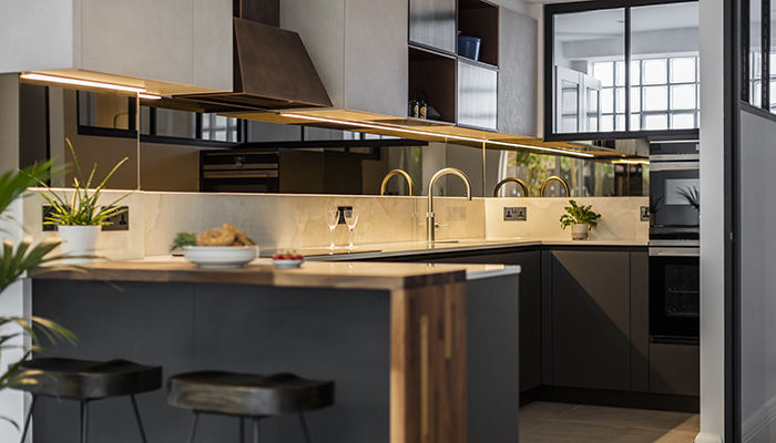 This kitchen designed by Multiliving by Scavolini provides the ultimate solution for task lighting installing energy efficient LED strip lighting under wall-mounted cabinetry illuminating the worktop beautifully