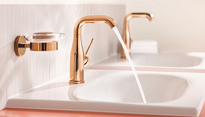 Grohe’s Essence basin mixer M-size in polished Warm Sunset