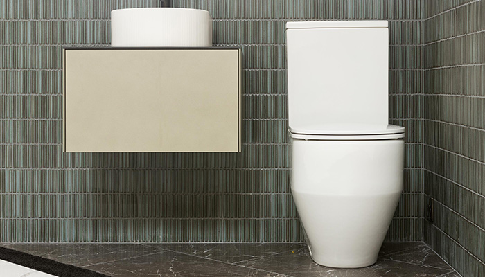 Laufen Sonar basin with ribbed exterior on a wall-mounted drawer unit with Laufen Pro rimless close coupled WC