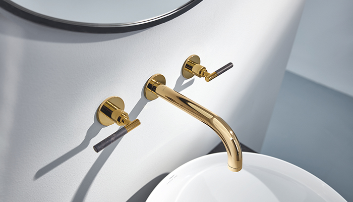 Grohe’s Atrio Private Collection basin mixer in Cool Sunrise finish with Caesarstone lever insets