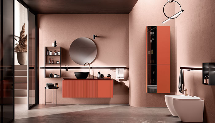 Scavolini's new Lido Collection is available in Comodoro Green and Morocco Red and features a vanity unit with slatted and plain door alongside a tall cabinet with a combined smoked glass panelled door that showcases the contents inside