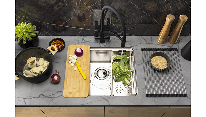 The System Sync 500mm single-bowl kitchen sink from Abode is made from 0.8mm 304 grade brushed stainless steel and comes with three complementary accessories: a prep board, stainless steel colander, and a roll-up FlexRack to create a customisable sink solution 