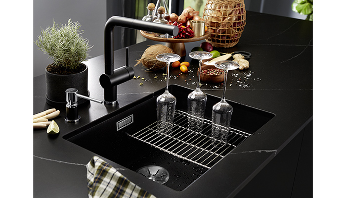 The Blanco Subline 500 U sink made from Silgranit is shown here with the Lato Soap Dispenser and kitchen sink floating Grid Drainer Trivet. The range includes two new finishes, tinted metal satin platinum and satin dark steel, a popular choice in kitchens, with warm neutrals, bold blacks and new metallics