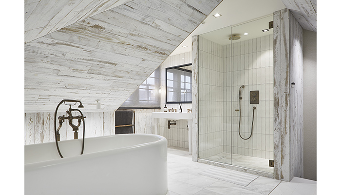 Havwoods’ reclaimed Veneer planks can be used on walls to add depth and interest to bathroom designs. In cool greys and off-whites, the Boreas Vertical planks seen here are perfect for Scandi-inspired schemes