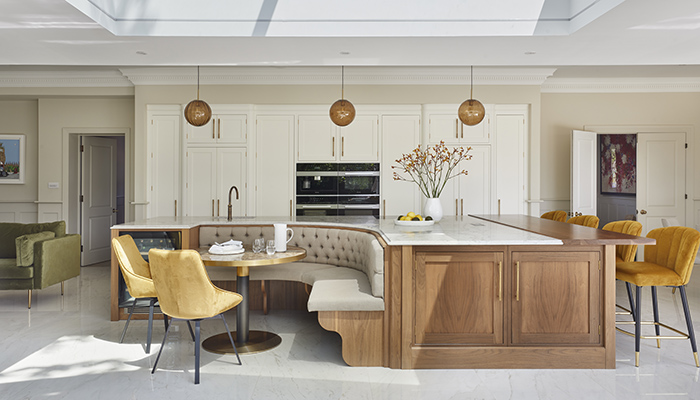 The multifunctional island in this kitchen, which was created in collaboration with Design Interiors and features Davonport’s Gillingham range, provides a variety of seating options, including curved banquette seating clad in velvet