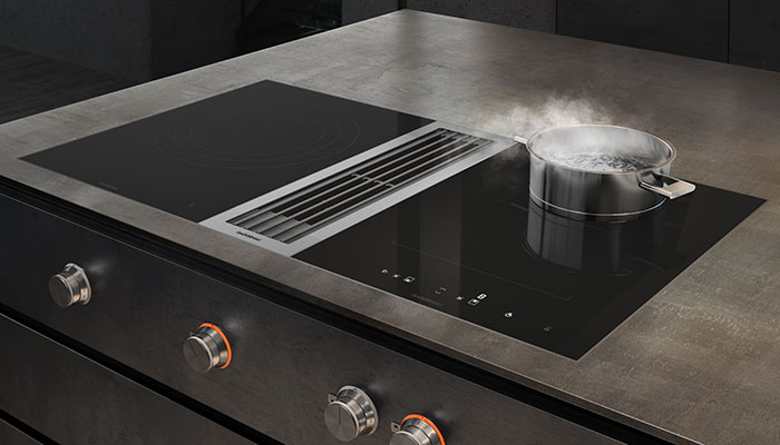 Gaggenau’s A+ rated VL414115 Vario 400 series downdraft ventilation has a maximum sound level of 71dB in normal mode. It’s designed for either flush installation or surface installation with a visible edge, and can be combined with other Vario appliances from the 400 series