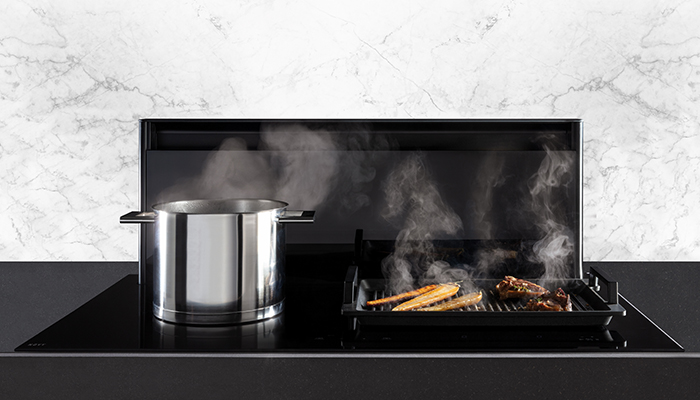 The Novy Panorama Pro is a powerful 90cm 4-zone vented downdraft induction hob. Rising to any height level up to 30cm, the Panorama Pro efficiently extracts cooking vapours at source. With a maximum free flow rate of 1160m³/h, it features 5 speeds plus 3 intensive speeds and has a B energy rating. Noise levels range from a minimum of 37dB at level 1 and a maximum continuous level of 57dB