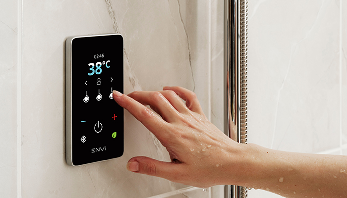 The ENVi electric shower features a control panel that enables users to remotely adjust water temperature, set a timer, and easily monitor water and energy usage