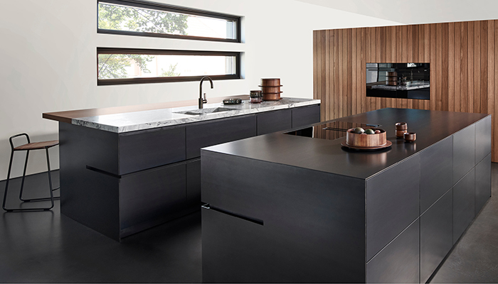 Available at The Myers Touch, Eggersmann’s black-steel + black-walnut kitchen offers maximum impact as well as complete individuality, with no two kitchens the same. Every colour gradient of black steel is individual, every cut is unique, and this is down to the production method – the material is rolled red-hot and forms the characteristic dark grey shimmering surface when it reacts with oxygen. Photograph @joachimgrothusfotografie