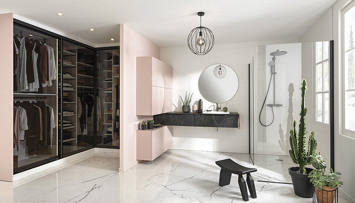 Adding a touch of spa-style luxury to this en suite dressing room, French manufacturer Schmidt’s Arcos Supermat laminate units in Nano black Marmor have been combined with matt lacquer Loft Micron units in La vie en Rose. The glass sliding doors in the dressing area are SOLE grey glass