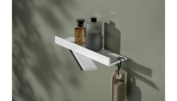 The Keuco REVA shower shelf is shown here with the integrated glass wiper in matt white, also available in matt black and is part of a larger collection including towel rails, toilet-roll holders and brushes, soap dishes and toothbrush holders