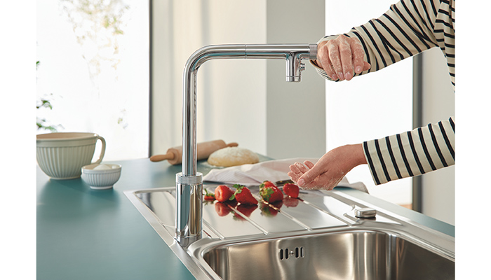 The Grohe Minta SmartControl tap can be switched on and off with the push of a button, which can be pressed by an elbow or wrist to help prevent cross contamination. It also has a pull-out dual spray, which can make washing produce and cleaning the sink easier