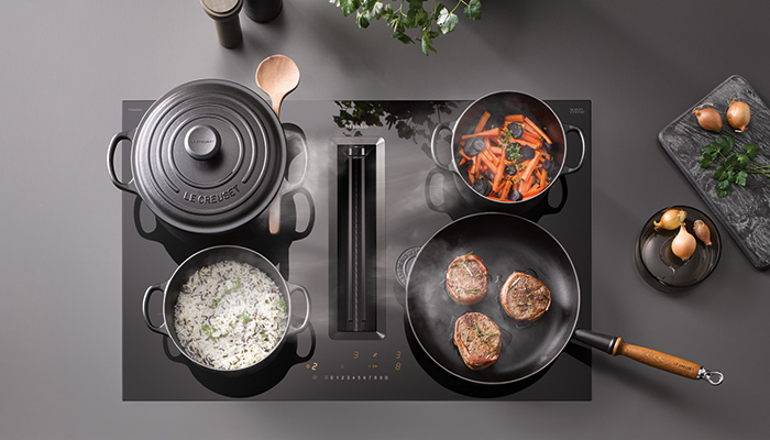 The Miele Silence downdraft hob with integrated extraction reacts automatically to the settings on the hob when steam is produced helping to save energy and is available in a choice of ducted or recirculation modes