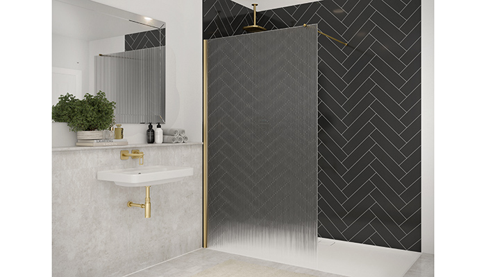 Merlyn Showers 8mm fluted glass wetroom panels in their latest brushed brass finish is suitable for a recess or corner situation, perfect for a smaller bathroom available in a variety of colour options including matt black, brushed bronze, brushed brass chrome and brushed gunmetal grey