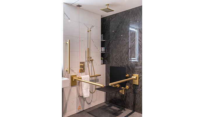 Designed to be Doc M-compliant as well as super stylish, this bathroom in London’s Kingsway Hall Hotel features stainless steel grab rails, backrests and shower seats in a gold PVD finish from Fitzroy of London’s Gosfield collection