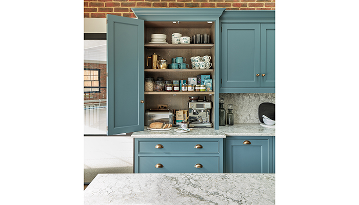 This breakfast pantry using the Summerville Collection in Inky Sky from Tom Howley Kitchens caters for the entire morning routine; coffee machine, toaster, crockery, and space cereals so they can be hidden behind closed doors