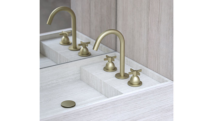 The handles are central to the design of the Folio range with dynamic lines and soft curves. This deck-mounted basin tap with crosshead handles in Warm Brass adds an architectural look to a bathroom