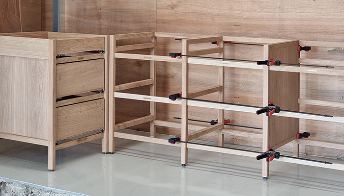 Inside the Cub Kitchens’ workshop in Sussex, showing solid timber frames in construction