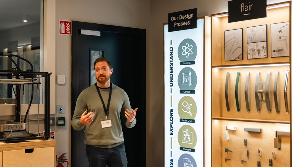 Ronán O’Grady, Lead Product Designer, Flair Showers, shows visitors the Testing Area