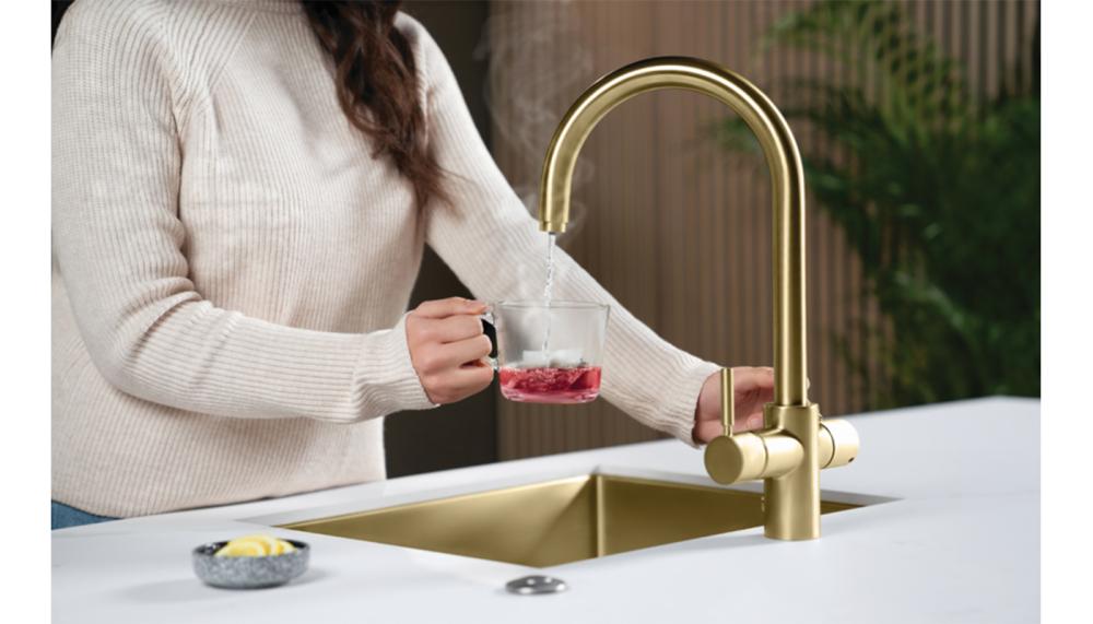 Pictured in brushed gold, the InSinkErator 4N1 Touch tap features a J shape and delivers steaming, 99°C hot water as well as hot, cold and filtered water