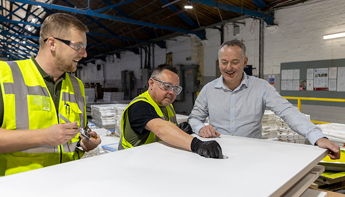 David with colleagues in the factory