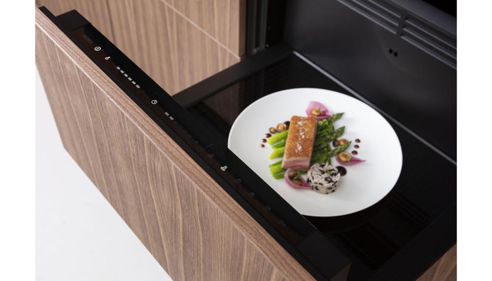 The perfect partner to the BORA X BO steam oven, the all-purpose BORA Multi-drawer is a versatile appliance featuring pre-set programmes for pre-heating crookery, low-temperature cooking, defrosting and regenerating food. It has a user-friendly touchscreen and is available with or without the black glass fascia