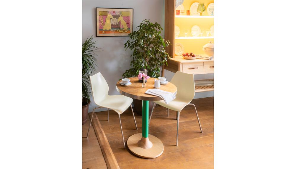 The circular Cafe Table Set can be used on its own or combined with a crescent-shaped model to extend the dining area