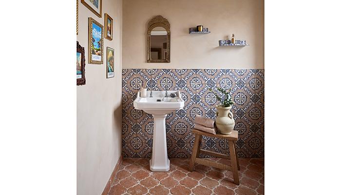 Ca'Pietra's Sardinia Porcelain Masseria tiles on the walls complement terracotta floor tiles