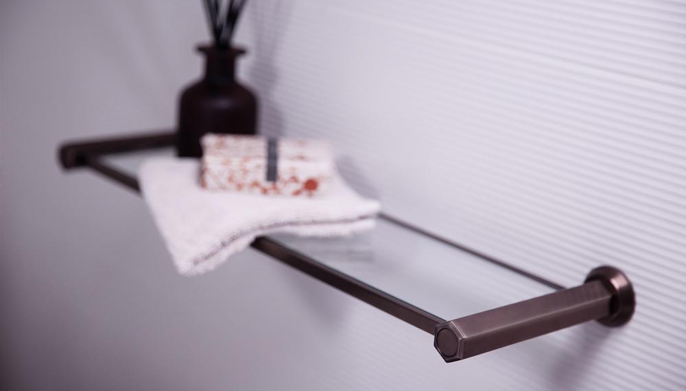 Matki Swadling Brassware Illustrious glass shelf is made from solid brass and 10mm thick safety glass. It comes in a range of finishes including Dark Bronze and Living Brass. Options available are a 450mm-wide shelf in a Chrome finish or can be customised in lengths up to 1metre wide