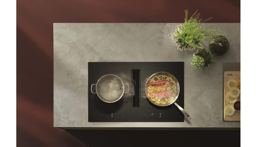 Franke's Mythos 2gether Slide 83cm-wide hob extractor features a patented automatic flap opening system – the only technology of its kind on the market. The Matt Black glass is scratch-resistant