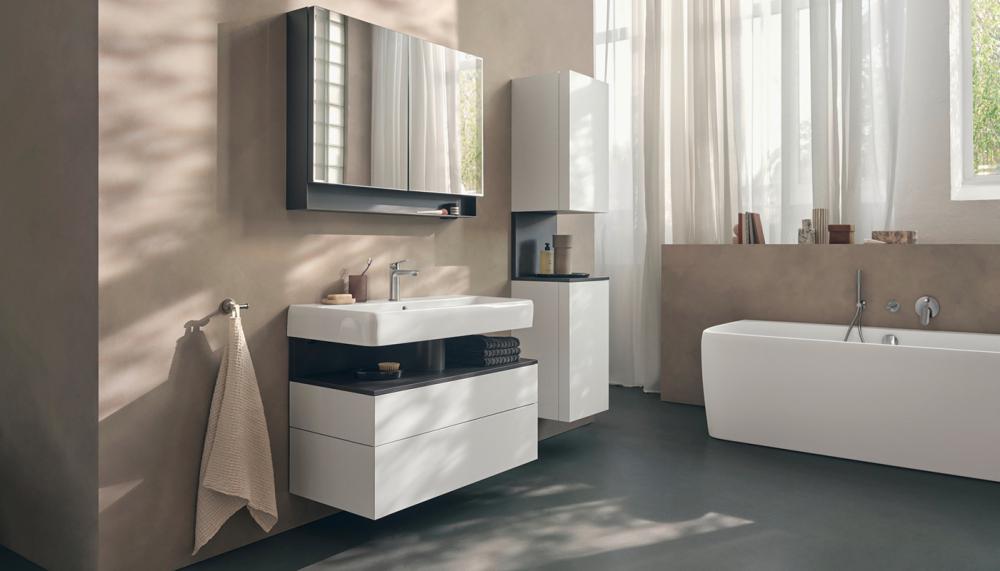 Gentle beige, sand, and taupe shades inform the atmosphere of this bathroom fitted with products from the Studio F. A. Porsche Collection