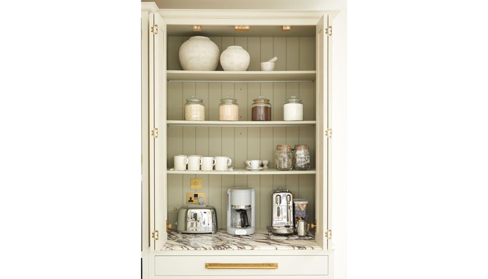 Olive & Barr&rsquo;s countertop bespoke double larder cabinet in a timeless Shaker design, incorporating bi-fold doors with contrasting panelling and worktop to provide the ideal coffee and breakfast station