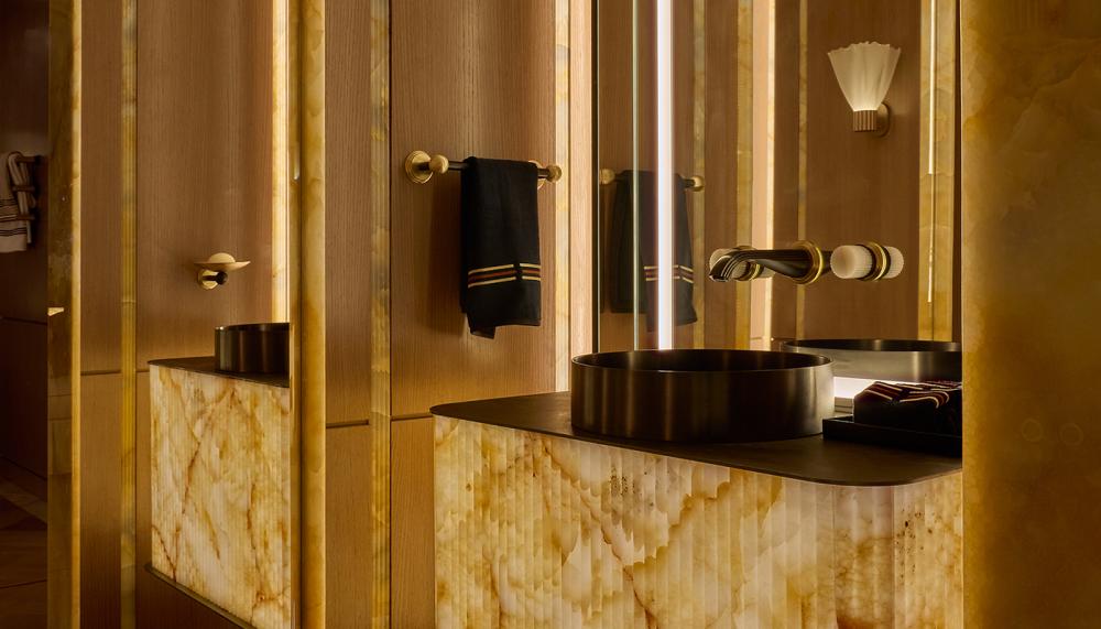 The Powder Room features THG Paris's Metal On-Counter Basin, La Fontaine Wall-Mounted Basin Mixer and Basin Handles