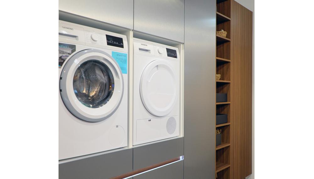 Rotpunkt&rsquo;s Zerox ME Inox and Zerox KQ furniture mixed with Italian walnut shelving