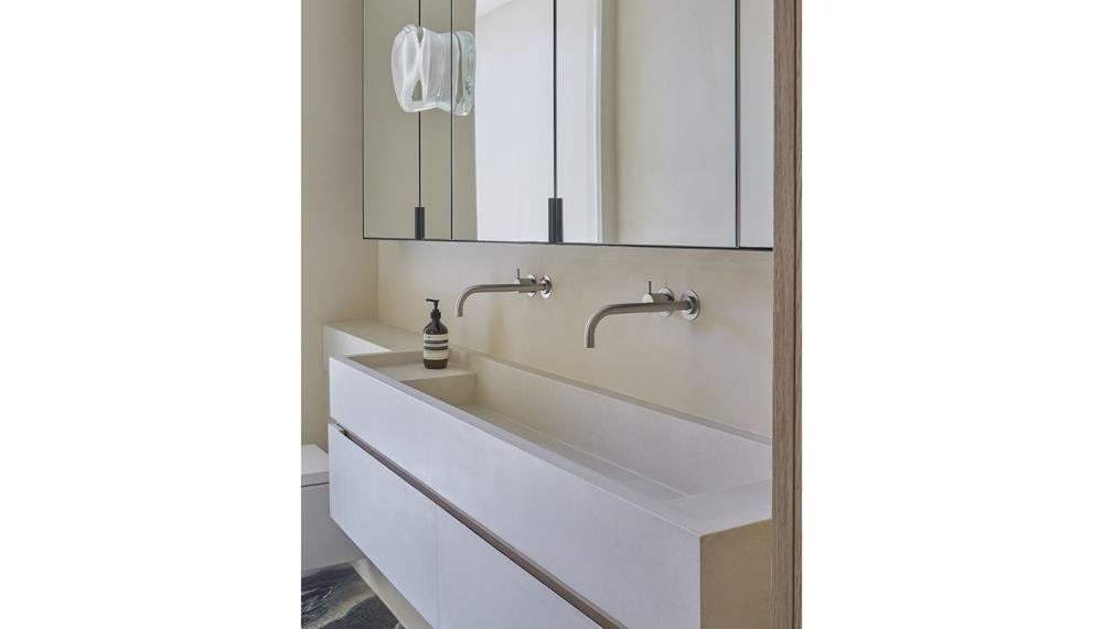 Custom basin in the master bathroom in Still House