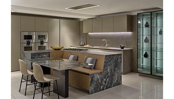Rotpunkt lacquer and ribbed wood units with worktops by CRL Stone and Gaggenau appliances