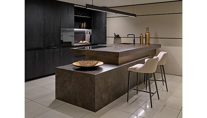 Rotpunkt Dark Oak tall cabinets with Inalco surfaces and Novy pendant light