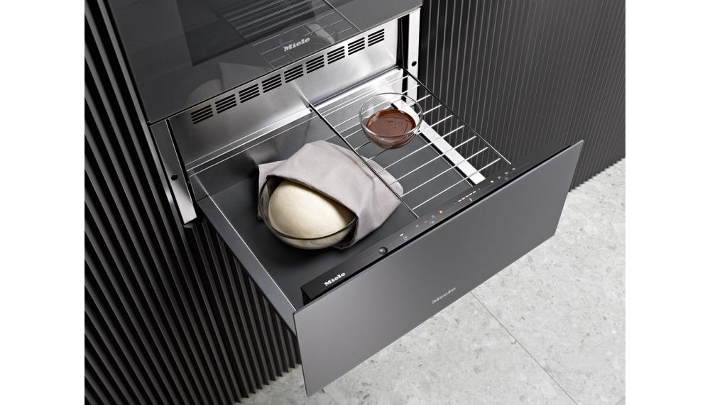 In a sleek Graphite grey finish, the Miele&nbsp;Generation 7000&nbsp;ESW 7010&nbsp;warming&nbsp;drawer provides the ideal environment for cooking meat and casseroles at a low temperature. Proving yeast dough for cakes, bread and pizzas is simple, while other uses including gentle, safe defrosting