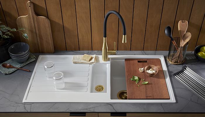 Made from Quarex – a hygienic, durable Quartz composite – the Kameo Smart from Clearwater Products is pictured here in Blizzard. The sink features a 'Smart Ledge' in each bowl, enabling a set of 4 accessories to be used for chopping, straining, and draining