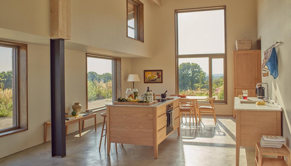 The new Borough freestanding kitchen collection, including the freestanding oak cooking island with Carrara marble top, centre