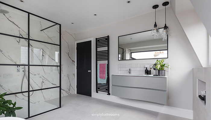 Impey walk-in vertical panel shower screen with Panda Marble porcelain wall tiles from Domus