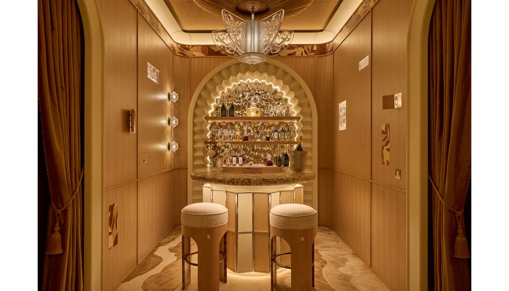 The bespoke bar is by James Wellesley, while the bar stools are buy Etons Bespoke