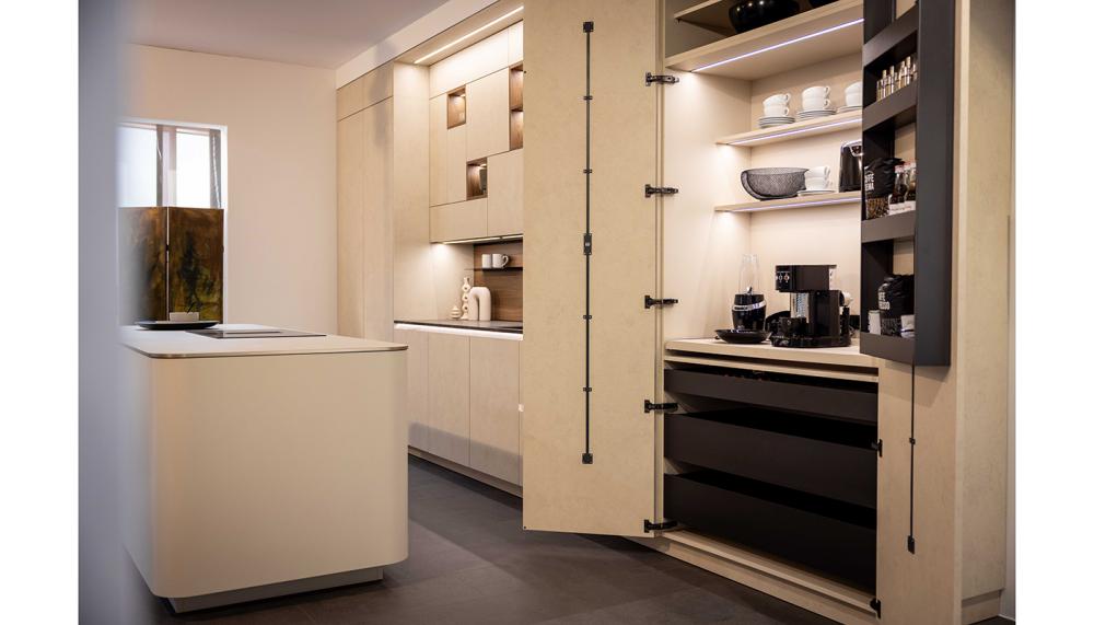 Rotpunkt&rsquo;s double sideboard with concealed coffee pull-out features makes an impressive floor-to-ceiling drinks station with fully integrated lighting within the shelving as standard for both morning and evening rituals