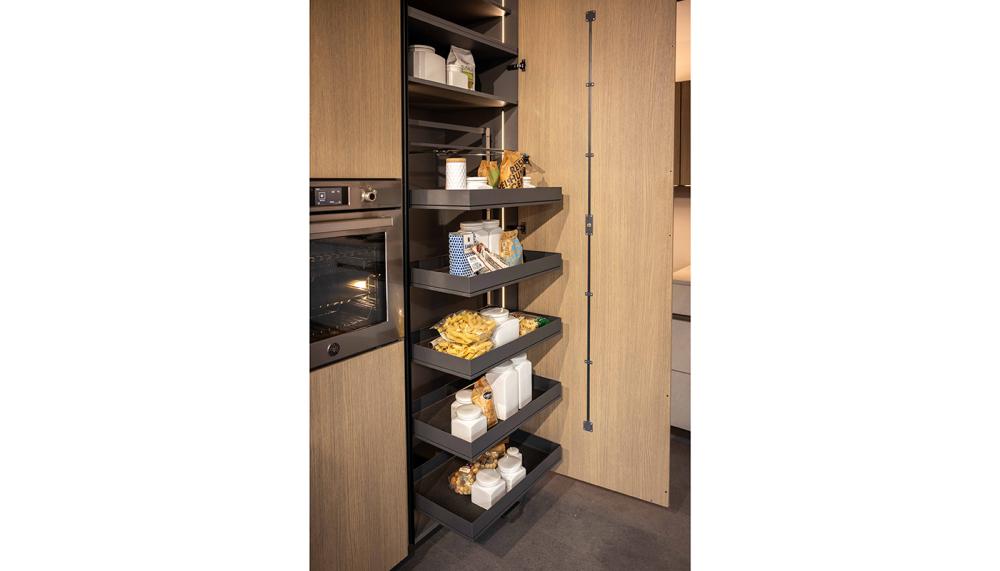 Rotpunkt&rsquo;s  Zerox SY VER Scandinavian Brown Oak & Zerox MA Sandy Beach kitchen features the Kesseb&ouml;hmer TANDEM pull-out larder, connecting the furniture and storage elements in one fluid motion. Includes 3-sided access, height-adjustable trays, and smooth-running rail technology for one-handed operation