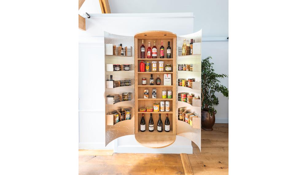 The wall-mounted Spice and Condiments Cupboard will fit in narrow spaces and comes with decorative metal doors, which are easy to keep clean