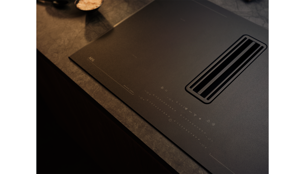 The AEG 6000 SaphirMatt induction extractor hob includes Auto mode extraction during cooking. The extractor's fan will adjust itself according to the temperature. A recirculation hob installation will require a 2-in-1 filter that combines both a charcoal and grease filter