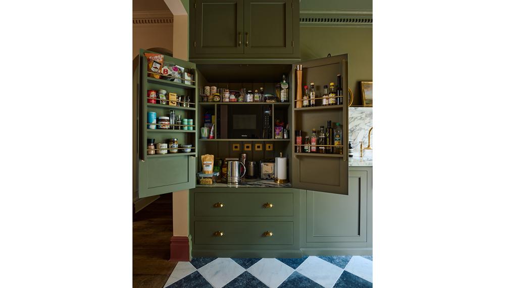 This is a more traditional-looking double-doored breakfast dresser from The Classic English Kitchen Collection from DeVol, equipped with plenty of storage, electrical sockets, integrated microwave and countertop space