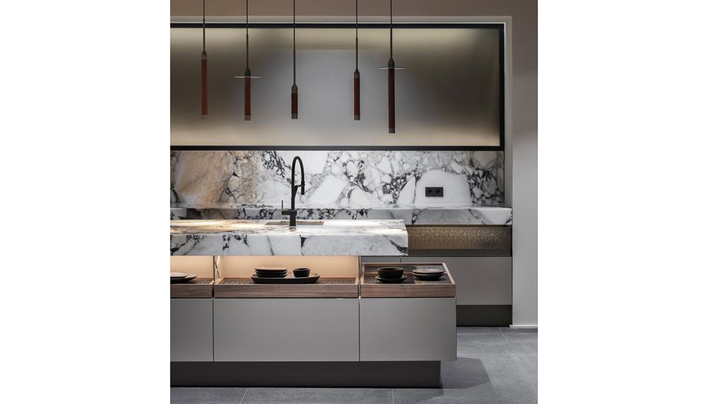 Poggenpohl’s reimagined +MODO collection, pictured in Light Brown Toffee Soft Matt with Walnut Pure wooden drawers, was created in collaboration with the Jorge Pensi design house
