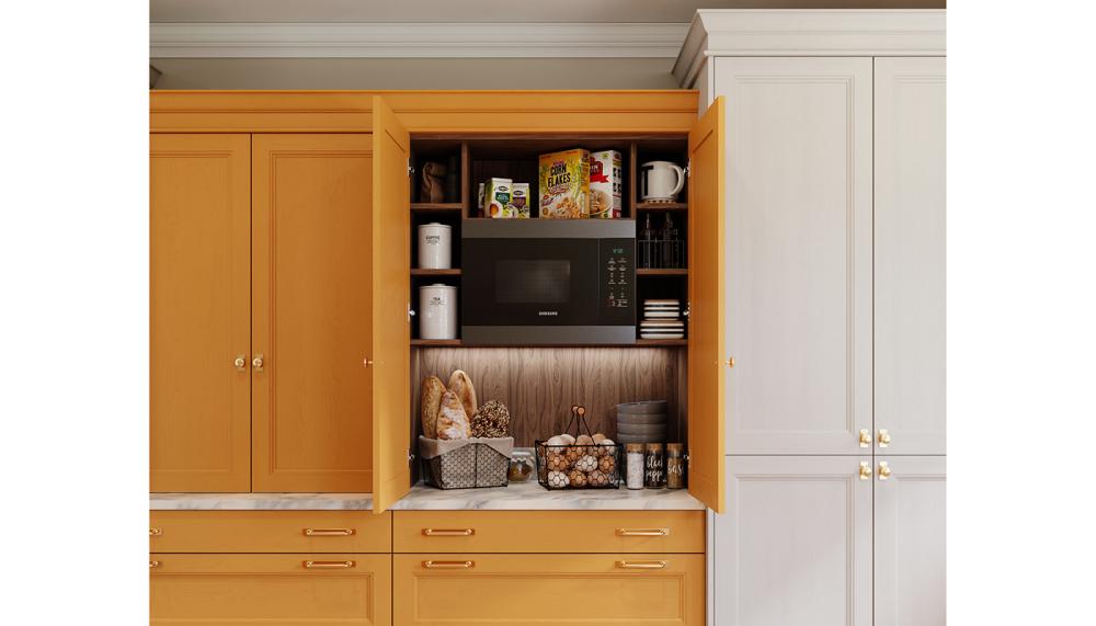 This countertop dresser from Lochanna Kitchens&rsquo; Rowan Collection in a vibrant warm orange integrates beautifully in the kitchen layout revealing a well stocked breakfast station and integrated Samsung microwave